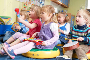 48849348-group-of-pre-school-children-taking-part-in-music-lesson